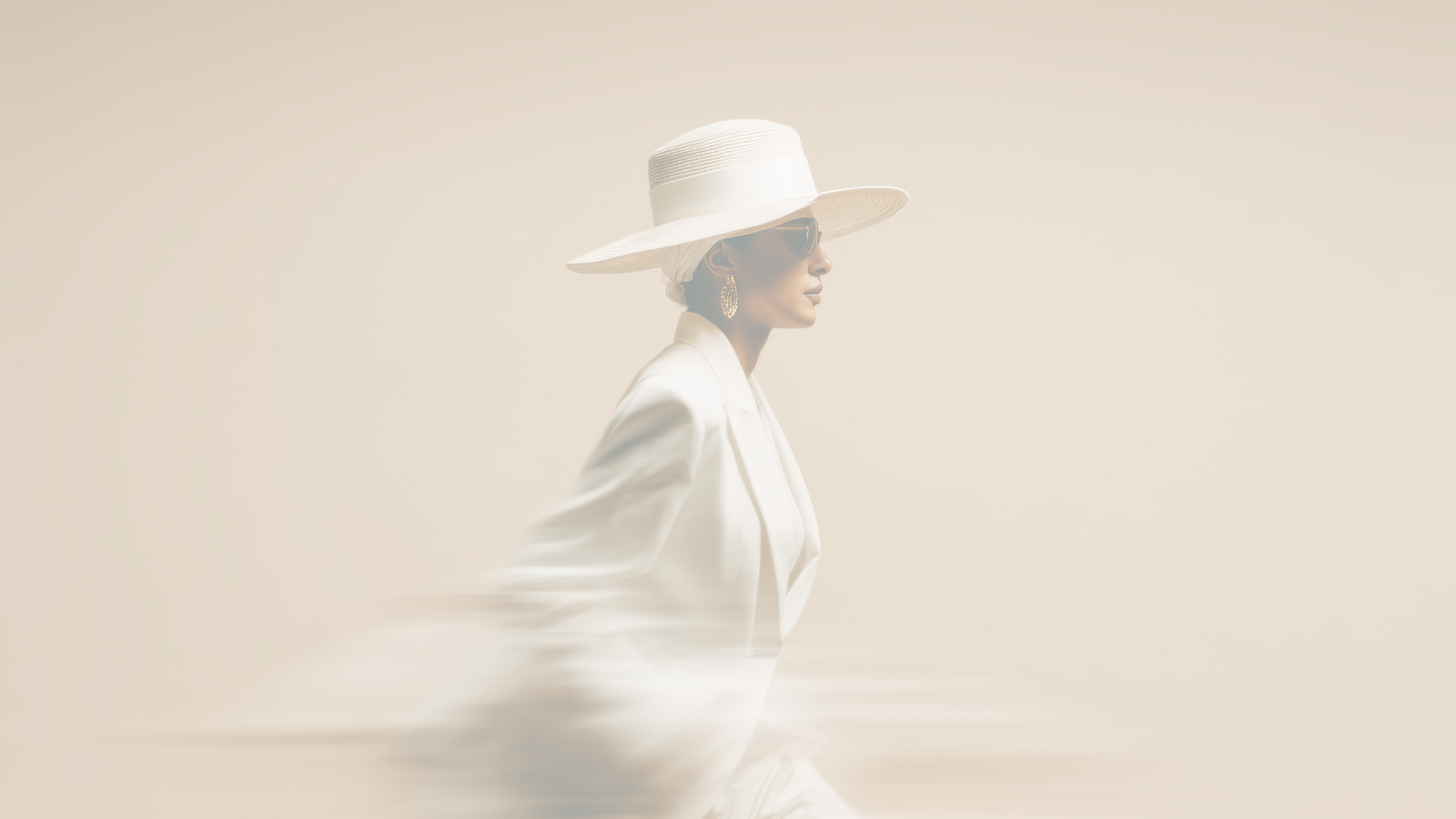 Female with a hat on and blazzer, blending with the beige background