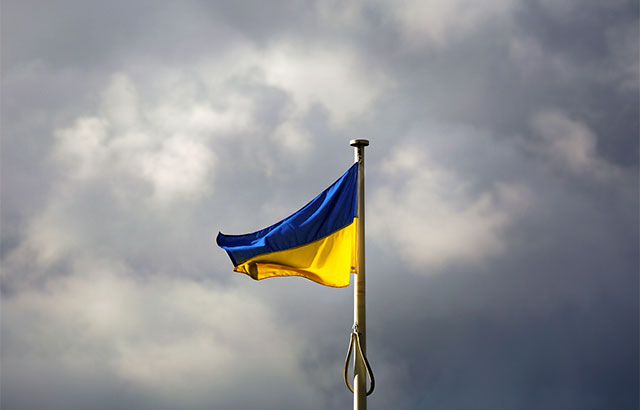 Ukraine flag against clouds