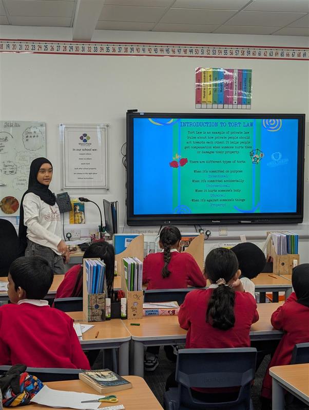 School Tasking Workshop Facilitator teaching in a classroom