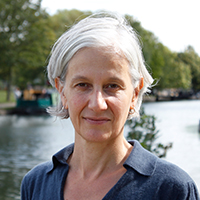 Headshot of Tessa Wright in front of a body of water