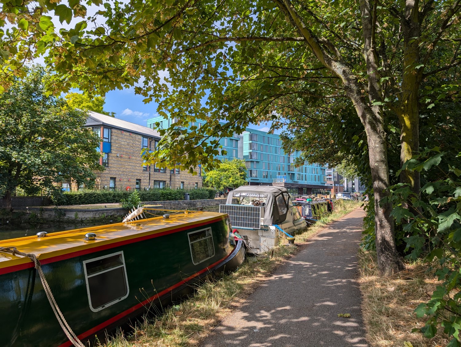 A photo of a canal boat in the Regents Canal, near Queen Mary's Mile End campus