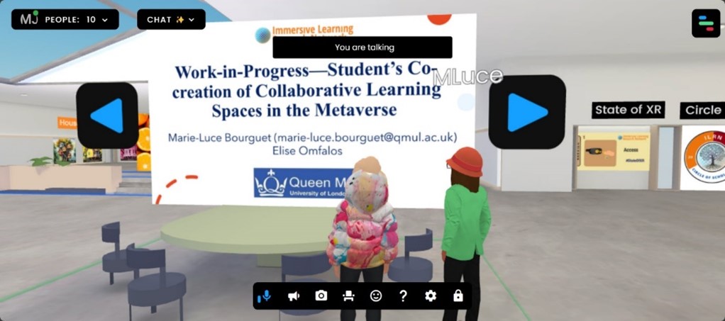Virtual and animated image. Two avatars looking at a screen within a large open space.